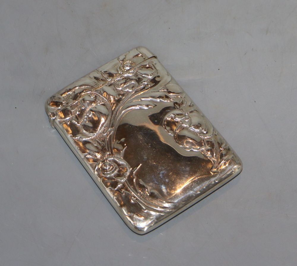 An Edwardian Art Nouveau embossed silver card case, William Neale Ltd, Chester, 1902, 10.1cm, 75 grams.